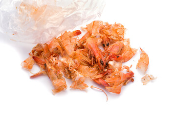 Shrimp food scraps and plastic bags on white background