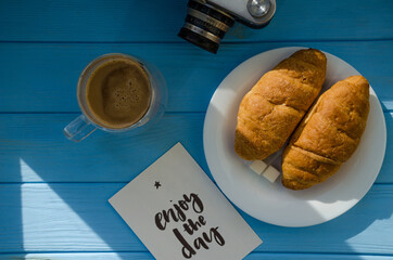 still life of cake with cup of coffee highlighted by sunlight