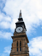 Fototapeta na wymiar the clock tower of the historic victorian atkinson building in southport merseyside against a blue summer sky