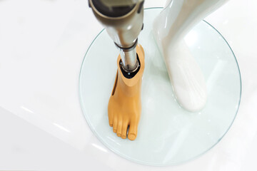 Metal prosthetic leg. Exhibition of modern prostheses. Prosthetics amputated limbs. Plastic...