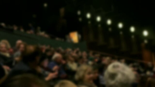 Spectators in the theater auditorium before the performance. Blurred view. 4K