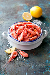 Boiled prawn shrimps in a ceramic pot, selective focus