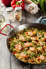 Traditional seafood paella with shrimp, fish and chicken seved i