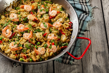 Traditional seafood paella with shrimp, fish and chicken seved i