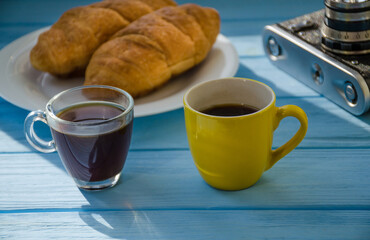 still life of cake with cup of coffee highlighted by sunlight