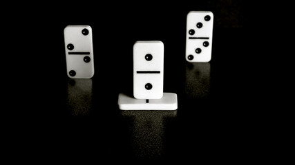 the first,second,and third place in the Domino achievement competition , the number one leader position, and ,above all, gambling are reflected on a black background of stone material