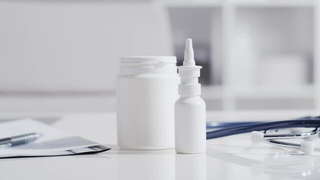 Close-up of different stuff and equipment on doctor's table in medical office in hospital.