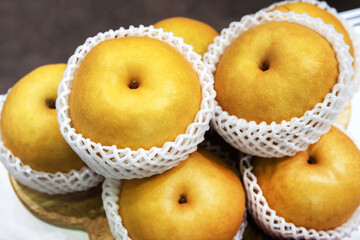 Asian apples in soft packaging. Trade and export of fruit to different countries. Close-up.