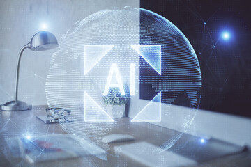 Double exposure of desktop computer and technology theme hologram. Concept of software development.