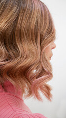 Obraz premium Blond hair after treatment with Curling iron.