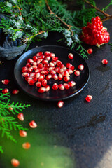 pomegranate red fruit sweet christmas dessert on the table new year tasty treat serving size top view copy space for text food background rustic
