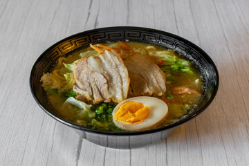 Miso ramen noodles with pork and egg in soy sauce flavored soup. Japanese food style