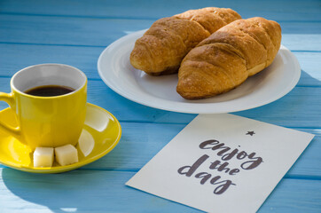 still life of cake with cup of coffee highlighted by sunlight