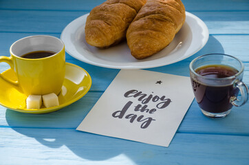 still life of cake with cup of coffee highlighted by sunlight