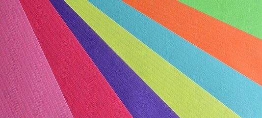 Multicolored background with sheets of kraft paper