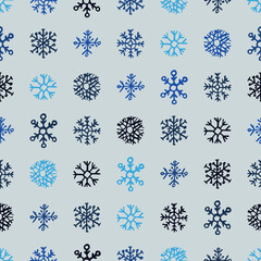 Seamless background of hand drawn snowflakes