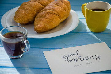 still life of cake with cup of coffee highlighted by sunlight