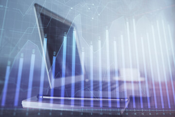Naklejka premium Forex Chart hologram on table with computer background. Double exposure. Concept of financial markets.