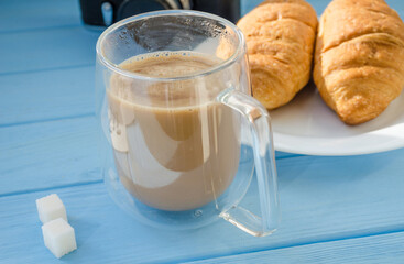 still life of cake with cup of coffee highlighted by sunlight