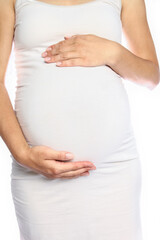 Happy pregnant girl lies on white background