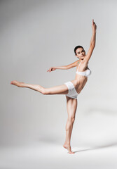 Fototapeta na wymiar ballerina dancing in white underwear