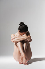 brunette woman resting on the floor