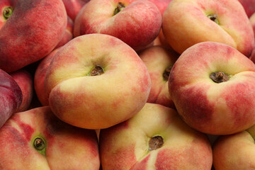 Heap of fresh donut peaches as background, closeup