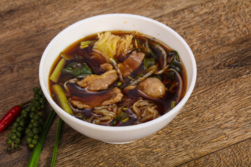 Thai style soup with meat and mushrooms