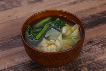 Asian traditional Wonton soup with herbs