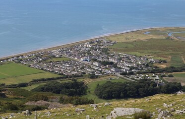 Fototapeta na wymiar A view from a high vantage point over Fairbourne, Gwynedd, Wales, UK.