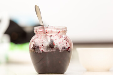 Old-fashioned blackcurrant blueberry jam on wooden background. Selective focus