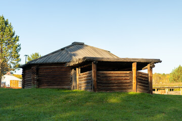 Natural landscape with wooden buildings.