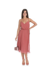 Naklejka premium Young woman wearing stylish pale pink dress on white background