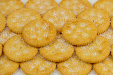 Pile of round cracker with sweet sugar on top pattern