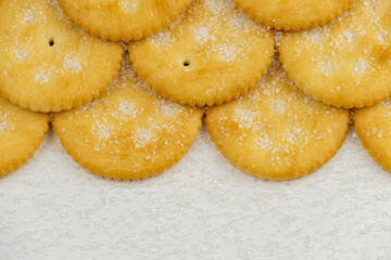 Pile of round cracker with sweet sugar isolated on white background