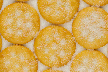 Spread of round cracker with sweet sugar isolated on white background