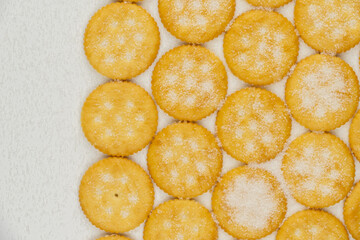 Spread of round cracker with sweet sugar isolated on white background