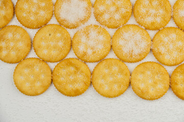 Spread of round cracker with sweet sugar isolated on white background