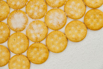 Spread of round cracker with sweet sugar isolated on white background