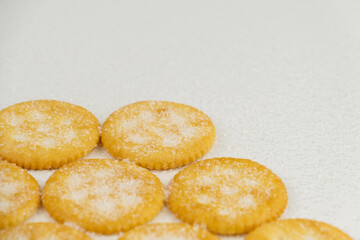 Spread of round cracker with sweet sugar isolated on white background