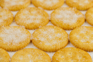 Spread of round cracker with sweet sugar isolated on white background