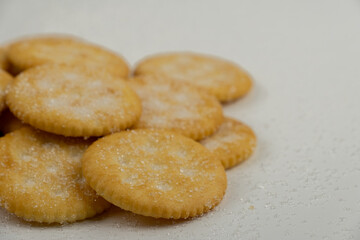 Pile of round cracker with sweet sugar isolated on white background