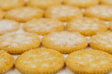 Spread of round cracker with sweet sugar isolated on white background