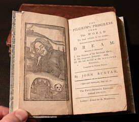 Bunyan's famous allegorical work 'Pilgrim's Progress' first printed in 1678. This edition printed around 100 years later with primitive woodcuts.  - obrazy, fototapety, plakaty