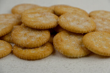Pile of round cracker with sweet sugar isolated on white background