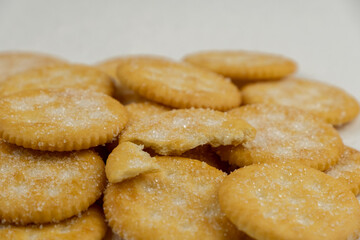 Pile of round cracker with sweet sugar isolated on white background