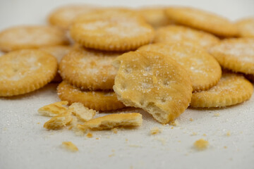 Fototapeta na wymiar Pile of round cracker with sweet sugar isolated on white background
