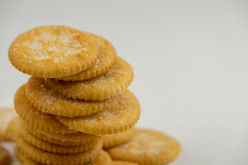 Pile of round cracker with sweet sugar isolated on white background