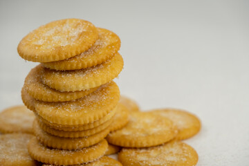 Pile of round cracker with sweet sugar isolated on white background