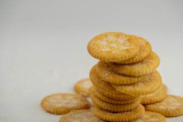 Pile of round cracker with sweet sugar isolated on white background